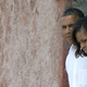 The president and the first lady peer out of the Door of No Return while touring Africa. (Jim Watson/AFP/Getty Images)